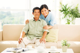 caregiver and old man smiling